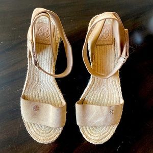 Tory Burch espadrille wedge sandals with wrap ankle strap in beige.